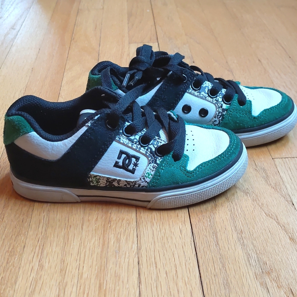 DC toddler green, black, and white skater shoe